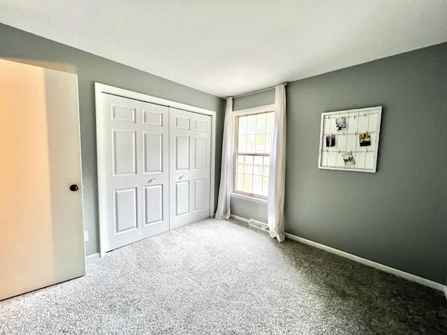 3676 Brentwood St Unit 30, Norton Shores, MI 49441 - unfurnished bedroom with carpet flooring and a closet
