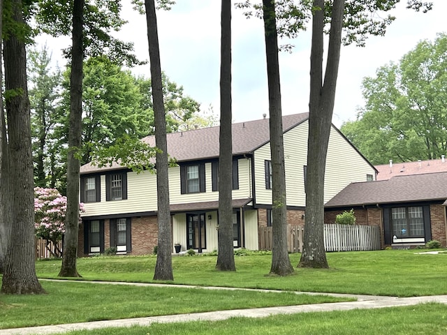 3676 Brentwood St Unit 30, Norton Shores, MI 49441 - view of front of property with brick siding and roof with shingles