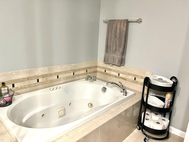 3676 Brentwood St Unit 30, Norton Shores, MI 49441 - bathroom with a whirlpool tub and tile patterned floors