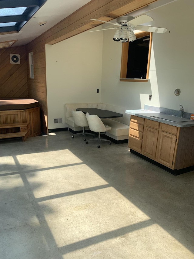 5513 S Waverly Rd, Lansing, MI 48911 - misc room with wood walls and a skylight