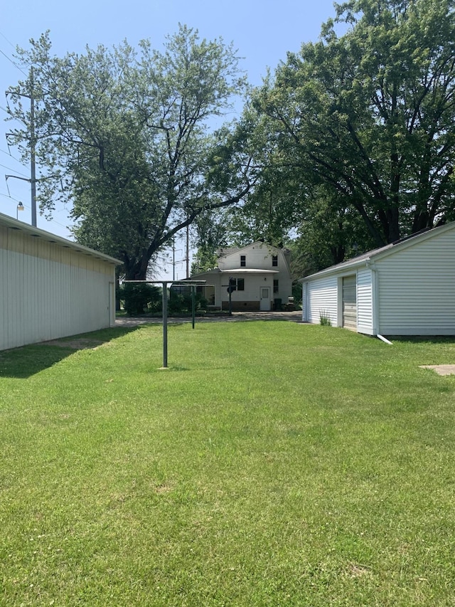 5513 S Waverly Rd, Lansing, MI 48911 - view of green lawn featuring an outbuilding