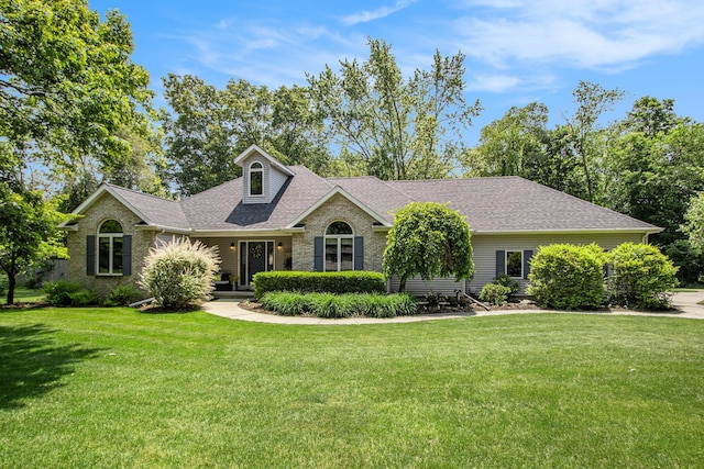27569 Hawthorne Rd, Sturgis, MI 49091 - view of front of property with a front lawn, roof with shingles, and brick siding