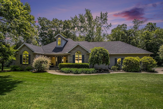 27569 Hawthorne Rd, Sturgis, MI 49091 - view of front of home featuring a front yard, roof with shingles, and brick siding