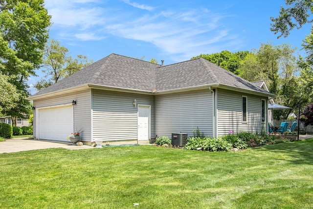 27569 Hawthorne Rd, Sturgis, MI 49091 - view of side of property with a lawn, a shingled roof, an attached garage, and driveway