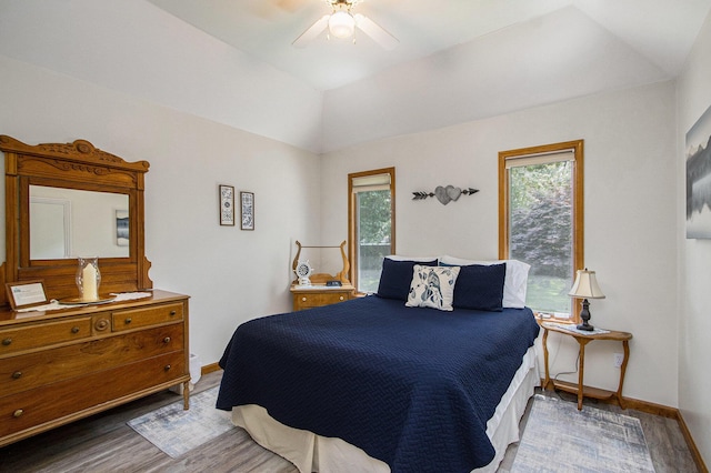 27569 Hawthorne Rd, Sturgis, MI 49091 - bedroom with wood finished floors, multiple windows, ceiling fan, and lofted ceiling