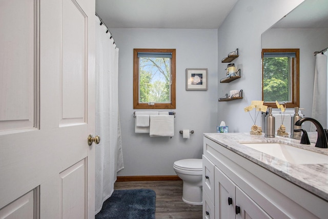 27569 Hawthorne Rd, Sturgis, MI 49091 - full bathroom featuring vanity, healthy amount of natural light, and wood finished floors