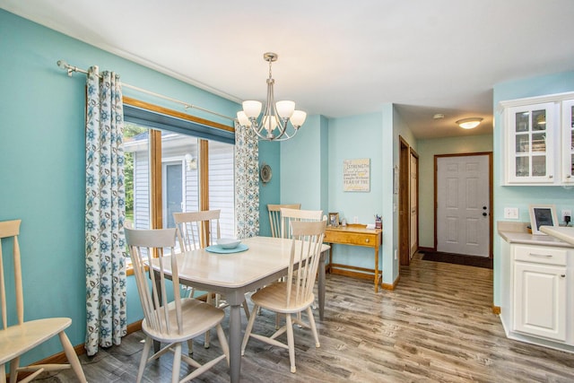 27569 Hawthorne Rd, Sturgis, MI 49091 - dining room with a chandelier and wood finished floors