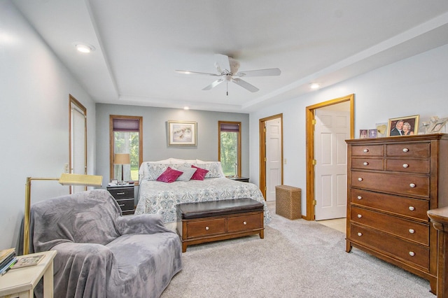 27569 Hawthorne Rd, Sturgis, MI 49091 - bedroom with multiple windows, light colored carpet, a raised ceiling, a ceiling fan, and recessed lighting