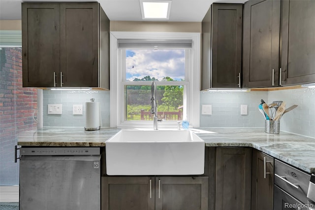 1348 Tull Dr, Waterford, MI 48327 - kitchen with stainless steel dishwasher, dark brown cabinets, tasteful backsplash, and light stone counters