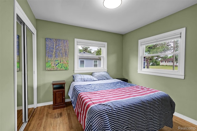 1348 Tull Dr, Waterford, MI 48327 - bedroom with wood finished floors and a closet