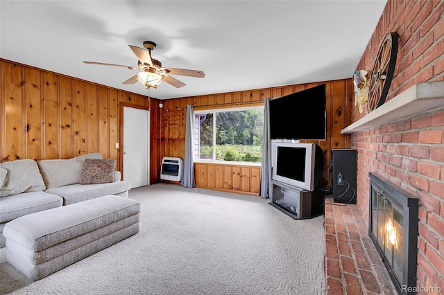 1348 Tull Dr, Waterford, MI 48327 - living area with heating unit, ceiling fan, a brick fireplace, wood walls, and carpet flooring