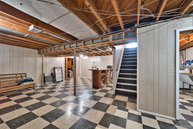 11214 Canal Rd, Sterling Heights, MI 48314 - basement featuring tile patterned floors, wood walls, and stairs