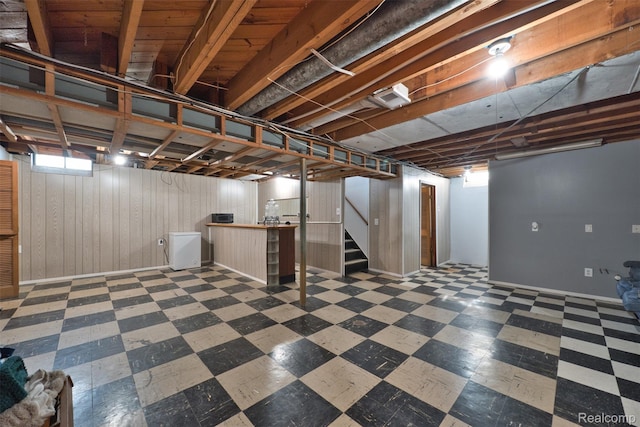 11214 Canal Rd, Sterling Heights, MI 48314 - basement featuring tile patterned floors, stairway, and wood walls