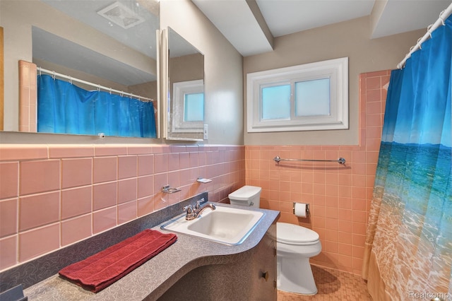 11214 Canal Rd, Sterling Heights, MI 48314 - bathroom featuring vanity, tile walls, a shower with shower curtain, a wainscoted wall, and tile patterned floors