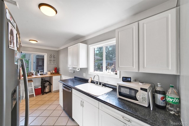 11214 Canal Rd, Sterling Heights, MI 48314 - kitchen with stainless steel appliances, white cabinets, dark countertops, and light tile patterned floors