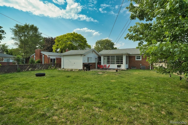 11214 Canal Rd, Sterling Heights, MI 48314 - rear view of house with brick siding and a patio