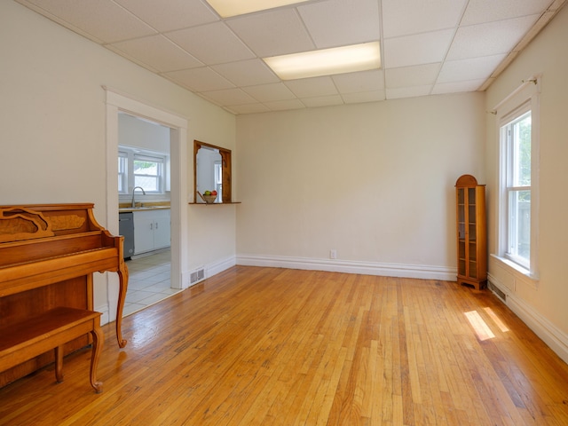 1232 Upland Dr, Kalamazoo, MI 49048 - spare room featuring a drop ceiling and light wood-style flooring