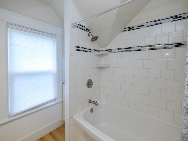 1232 Upland Dr, Kalamazoo, MI 49048 - bathroom with shower / bathtub combination with curtain, wood finished floors, and vaulted ceiling