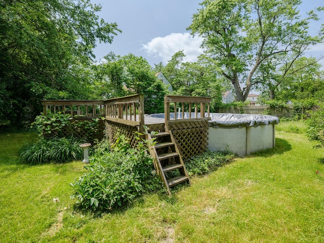 1232 Upland Dr, Kalamazoo, MI 49048 - view of green lawn with a wooden deck