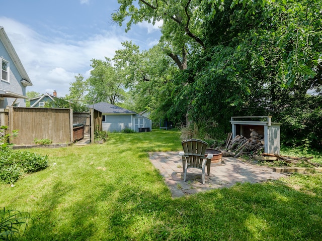 1232 Upland Dr, Kalamazoo, MI 49048 - view of yard with a patio area and an outdoor fire pit
