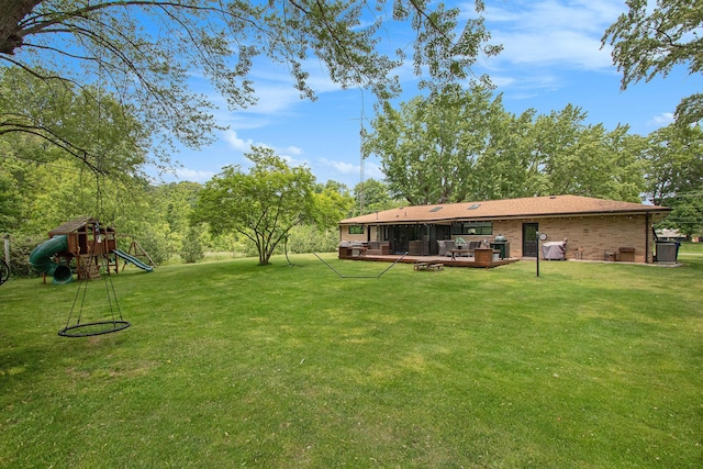 584 Benson Rd, Benton Harbor, MI 49022 - view of grassy yard with a playground and a deck