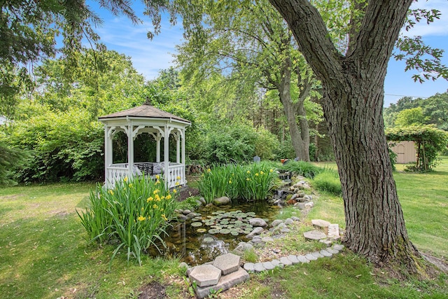 584 Benson Rd, Benton Harbor, MI 49022 - view of grassy yard featuring a gazebo and a garden pond