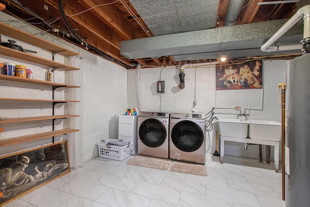 584 Benson Rd, Benton Harbor, MI 49022 - washroom with washing machine and dryer, marble look tiles, and concrete block wall