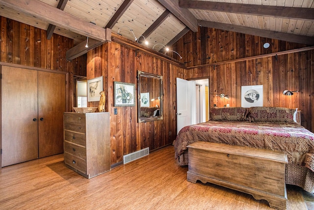 2347 W W Dowling Rd, Delton, MI 49046 - bedroom with wood walls, wood finished floors, high vaulted ceiling, and a wooden ceiling with exposed beams