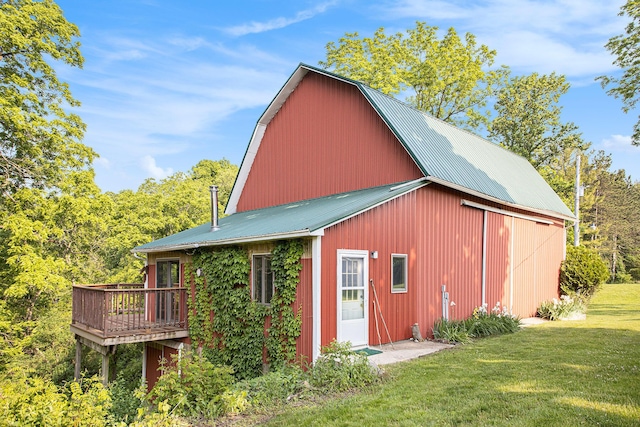2347 W W Dowling Rd, Delton, MI 49046 - rear view of house featuring a yard, an outdoor structure, a barn, and a metal roof