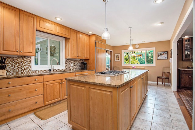 2347 W W Dowling Rd, Delton, MI 49046 - kitchen with tasteful backsplash, light tile patterned flooring, light stone counters, stainless steel gas cooktop, and recessed lighting