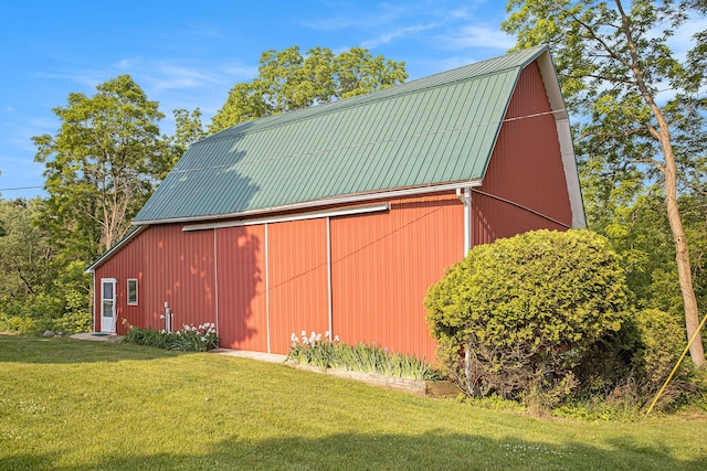 2347 W W Dowling Rd, Delton, MI 49046 - view of home's exterior featuring a barn, a detached garage, a gambrel roof, a lawn, and an outdoor structure