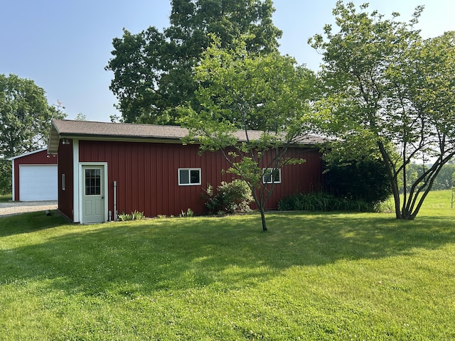 2347 W W Dowling Rd, Delton, MI 49046 - view of grassy yard with an outdoor structure and a detached garage