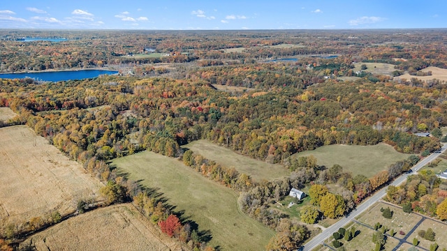 2347 W W Dowling Rd, Delton, MI 49046 - aerial overview of property's location featuring a heavily wooded area and a nearby body of water