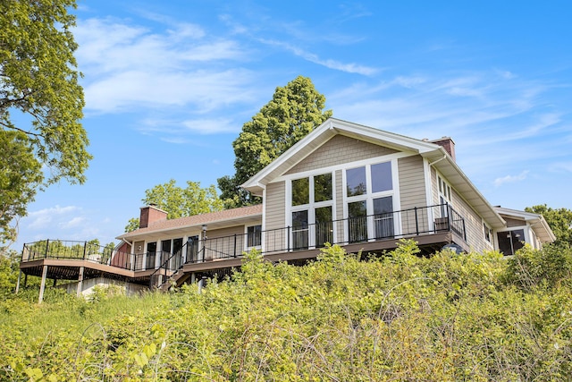 2347 W W Dowling Rd, Delton, MI 49046 - back of property featuring a chimney and a deck