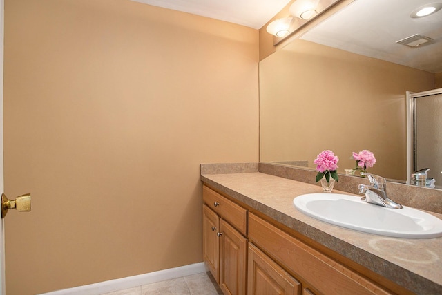2347 W W Dowling Rd, Delton, MI 49046 - full bathroom with vanity, a shower with door, and tile patterned flooring