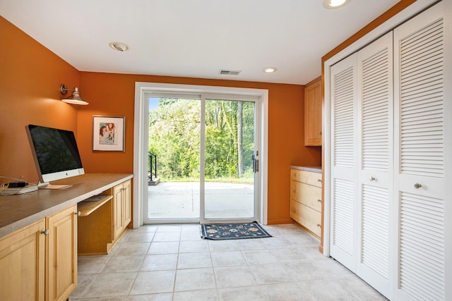 2347 W W Dowling Rd, Delton, MI 49046 - doorway featuring recessed lighting, light tile patterned flooring, and built in desk