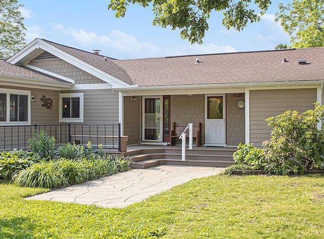 2347 W W Dowling Rd, Delton, MI 49046 - view of front of house featuring a front yard, a porch, and roof with shingles