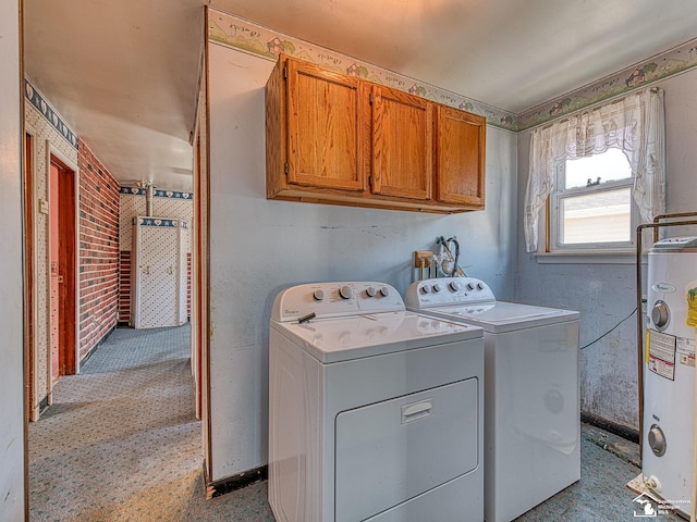 2109 Spaulding Rd, Monroe, MI 48162 - washroom featuring electric water heater, cabinet space, and washer and clothes dryer