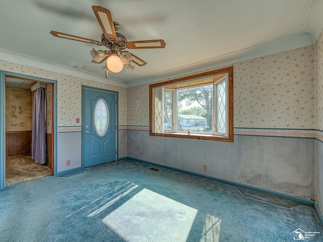 2109 Spaulding Rd, Monroe, MI 48162 - carpeted spare room featuring a wainscoted wall, wallpapered walls, and a ceiling fan