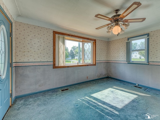 2109 Spaulding Rd, Monroe, MI 48162 - spare room with carpet floors, wallpapered walls, and a ceiling fan