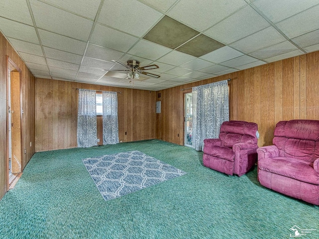 2109 Spaulding Rd, Monroe, MI 48162 - sitting room with carpet, wooden walls, a drop ceiling, and ceiling fan