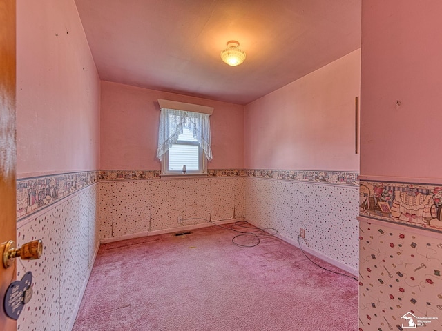2109 Spaulding Rd, Monroe, MI 48162 - unfurnished room featuring wainscoting, carpet, and wallpapered walls