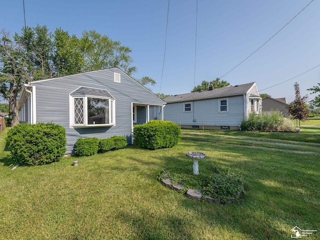 2109 Spaulding Rd, Monroe, MI 48162 - rear view of property featuring a yard