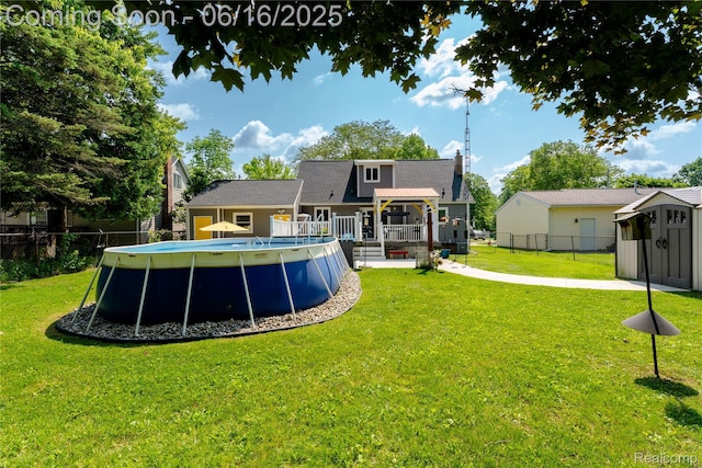 11704 Schram St, Grand Blanc, MI 48439 - rear view of property featuring a storage unit, a pergola, and a wooden deck
