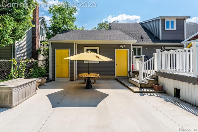 11704 Schram St, Grand Blanc, MI 48439 - view of front of property featuring a patio and roof with shingles