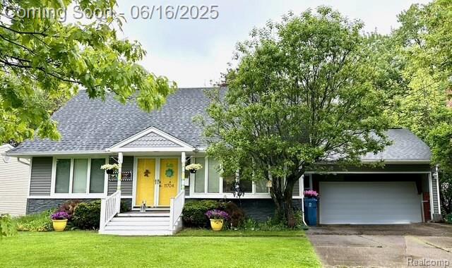 11704 Schram St, Grand Blanc, MI 48439 - view of front of home with roof with shingles, driveway, a garage, and a front lawn