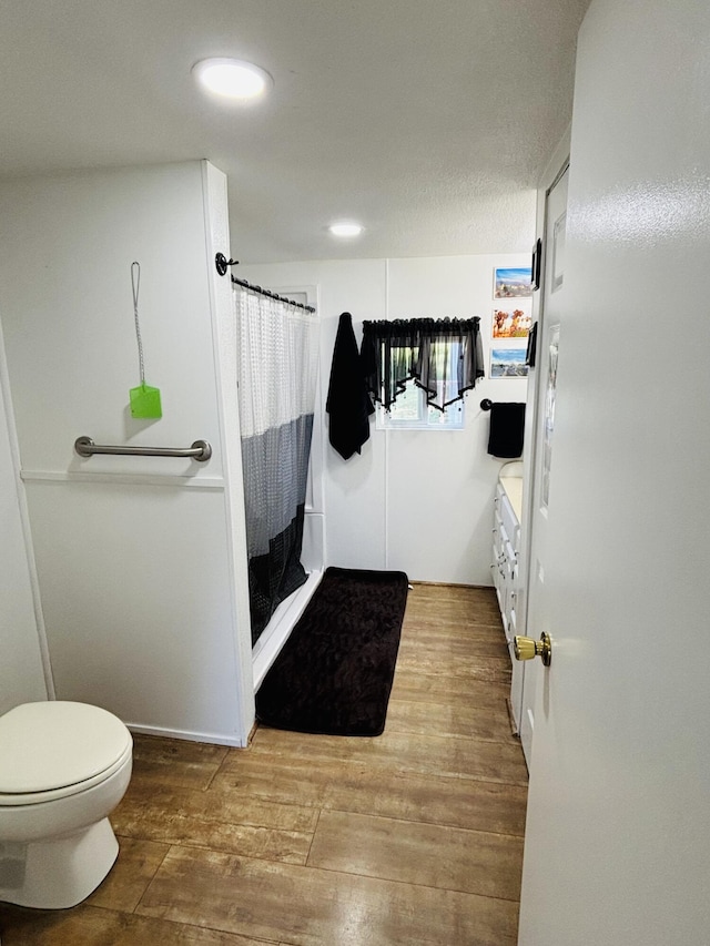 21794 30th Ave, Barryton, MI 49305 - full bathroom with hardwood / wood-style flooring, a shower with curtain, vanity, and recessed lighting