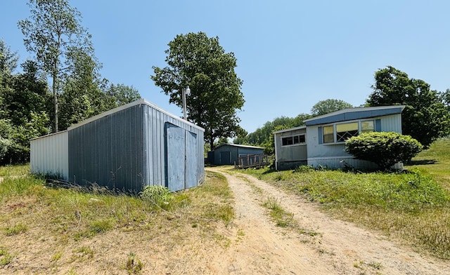 21794 30th Ave, Barryton, MI 49305 - view of shed with dirt driveway