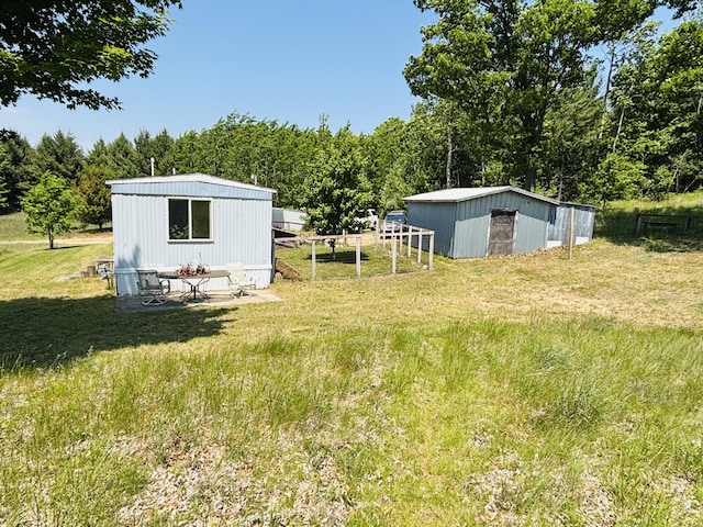 21794 30th Ave, Barryton, MI 49305 - view of yard with an outdoor structure and an outbuilding