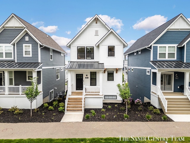 806 S Lake St, Whitehall, MI 49461 - view of front of property featuring a porch, a standing seam roof, board and batten siding, and stairway